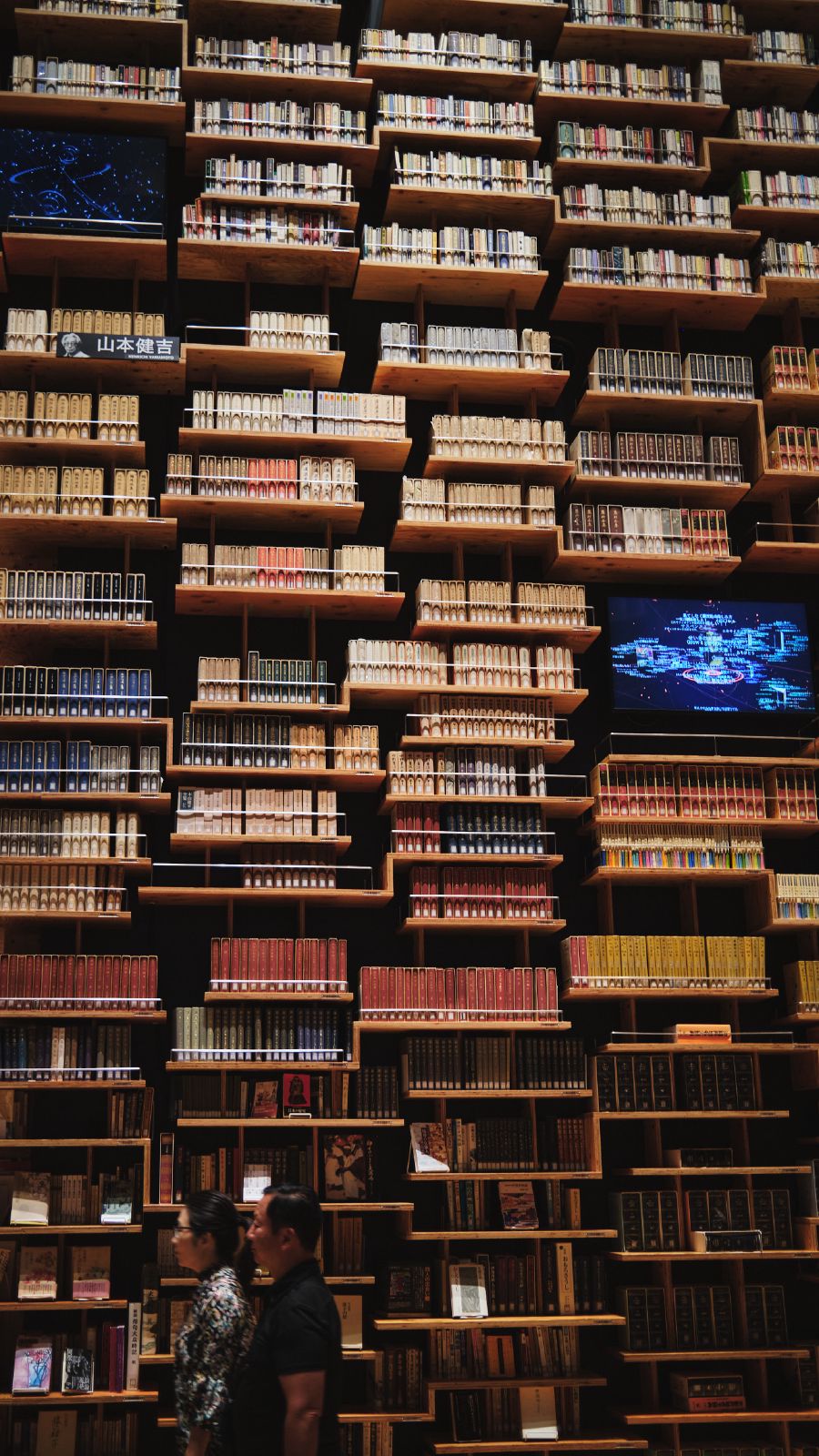 Japanese book publisher has this nice museum with room with a tall ceiling filled with books. They did a fun little projection mapping thing on them.