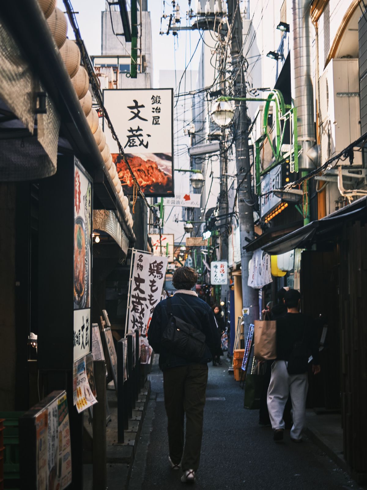 Walking through narrow streets filled with restaurants